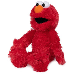 GUND Elmo 13-inch plush fur texture, soft shaggy red fabric.