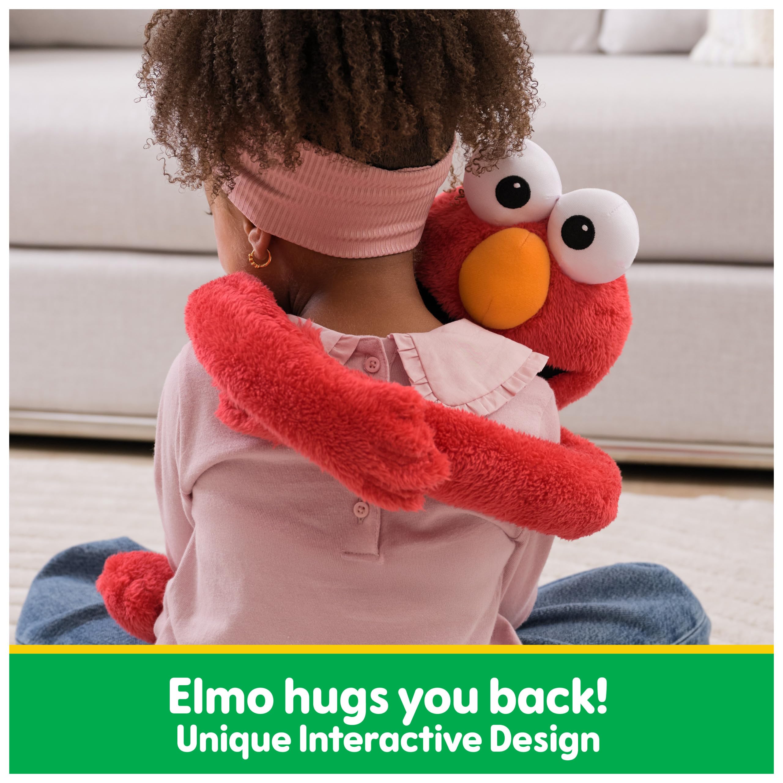 Elmo tummy press activates hug action for cuddles