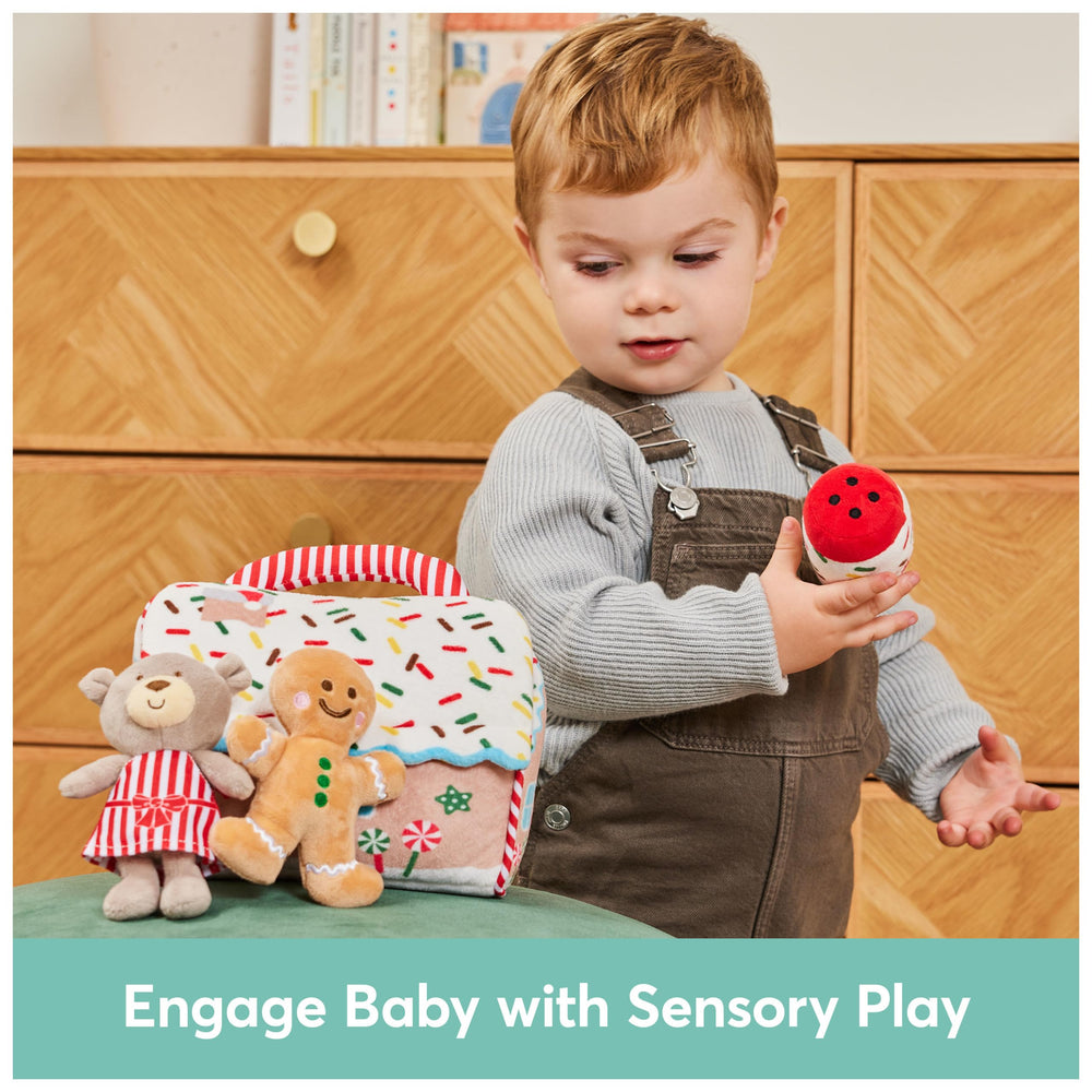 GUND frosting tube squeaker toy to engage sound and tactile play.
