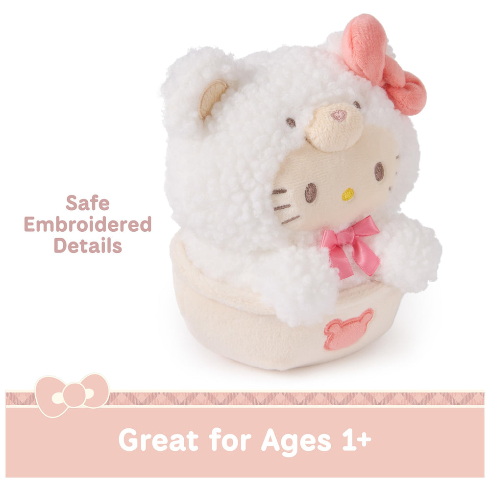 Hello Kitty Cafe Latte Bear sits in a tan mug; a playful coffee-break accent.