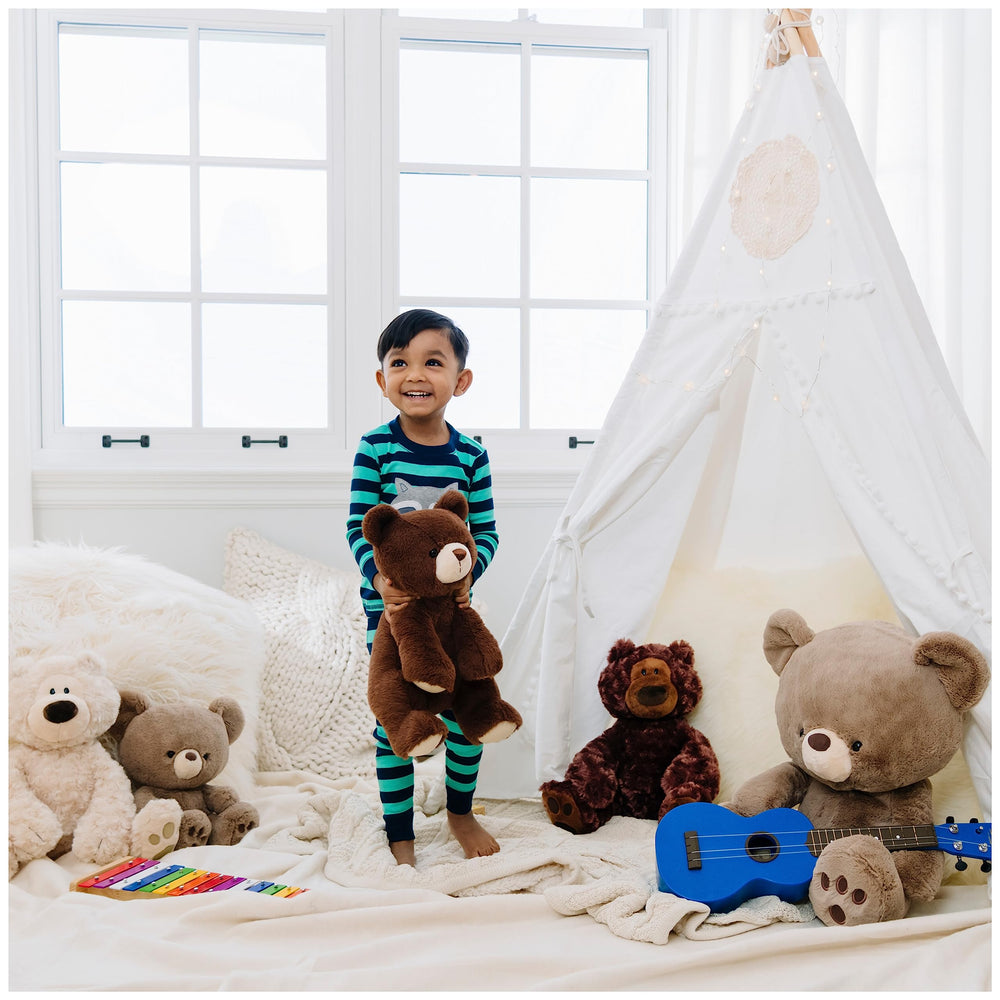 GUND Philbin with child showing age-appropriate soft toy for ages 1 and up.