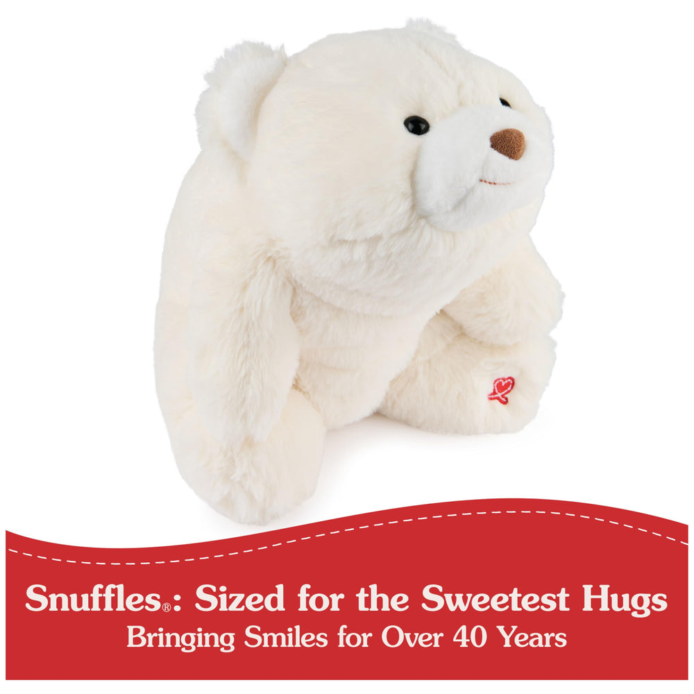 GUND Snuffles care tag indicates surface washable for easy cleaning.