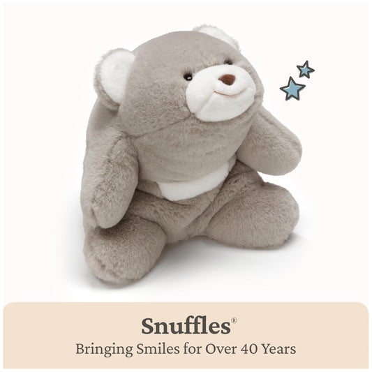 GUND Snuffles hug-back curved shape close-up emphasizing crescent cuddle.