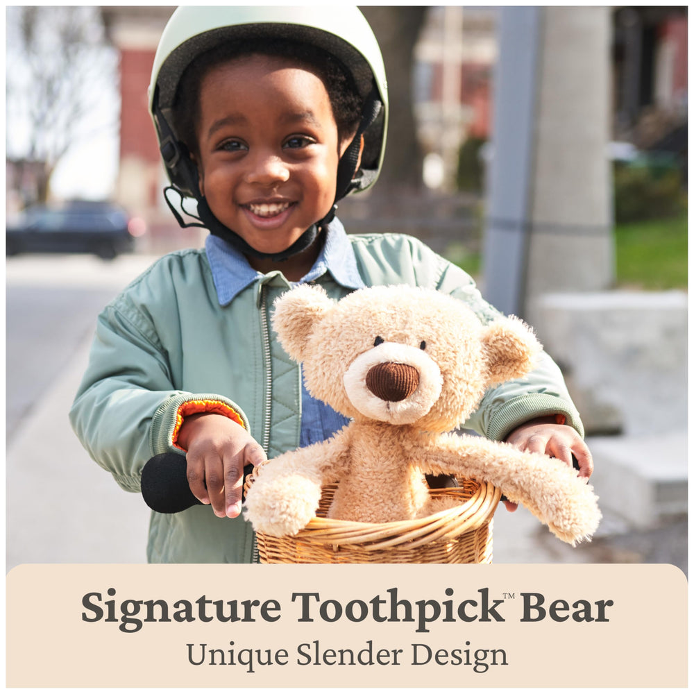 GUND Toothpick Cable teddy bear face close-up, textured plush feels like a soft sweater.