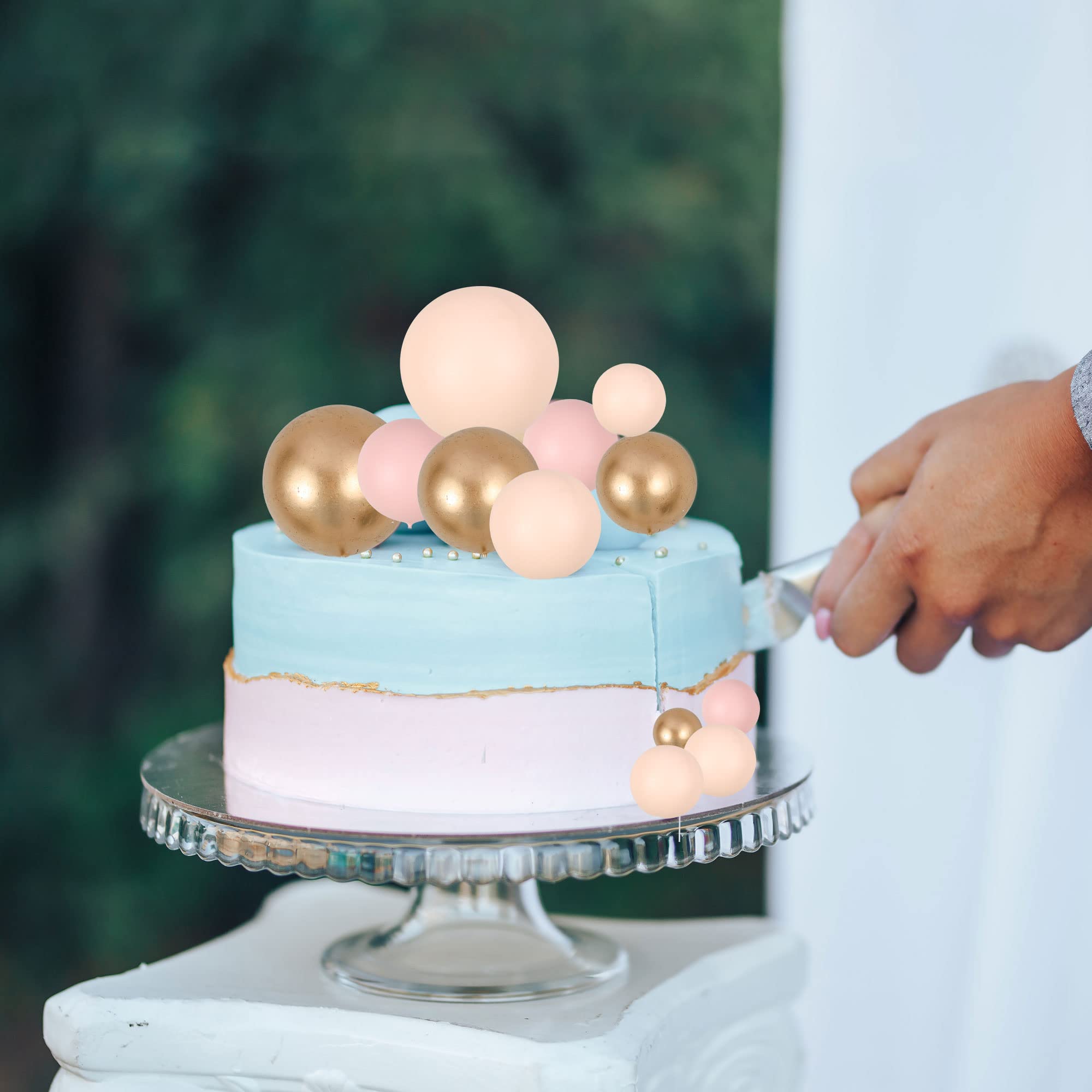 Gyufise ball cake topper in apricot gold provides safe decorative flair.