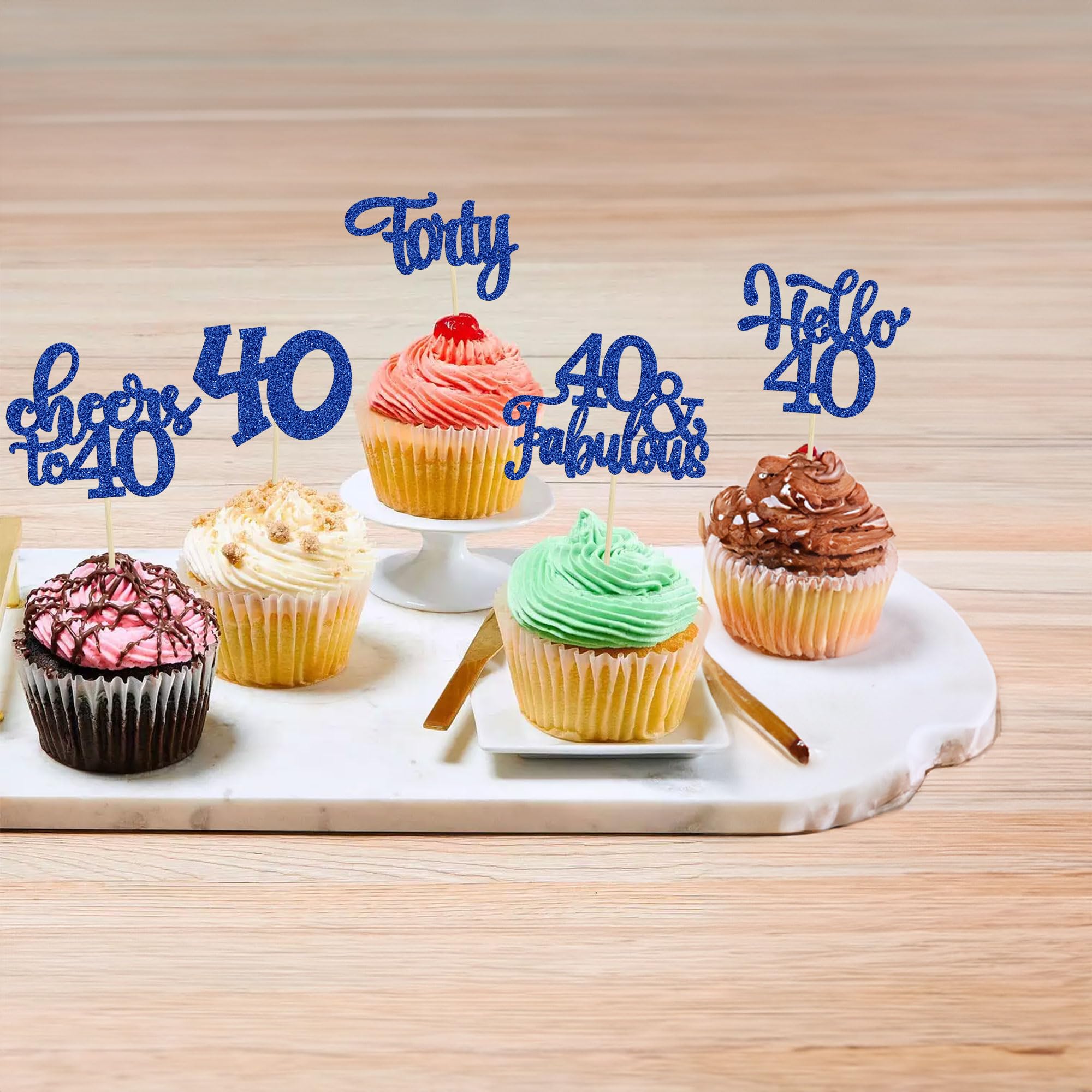 Gyufise cupcake toppers on desserts for eye-catching presentation.