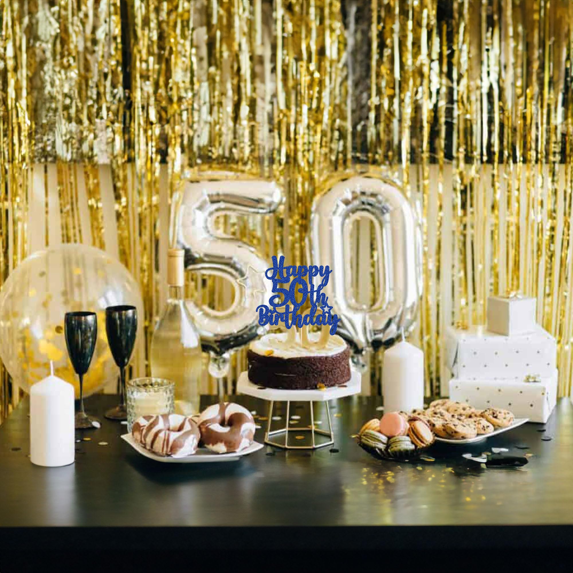 Gyufise happy 50th birthday topper on cake enhances party décor.