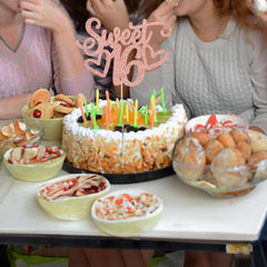 Gyufise Sweet 16 topper displayed on a cake.