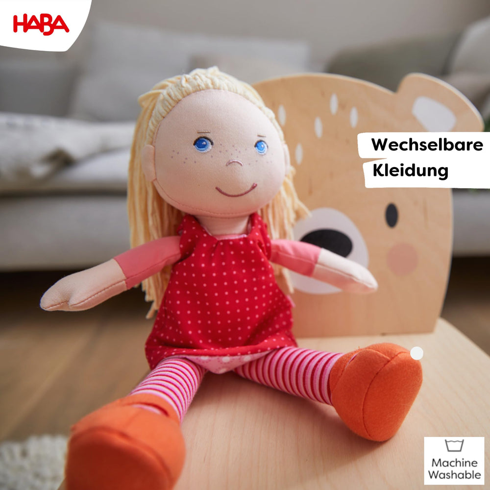 HABA Annelie doll with orange shoes sewn-on stay on during play.