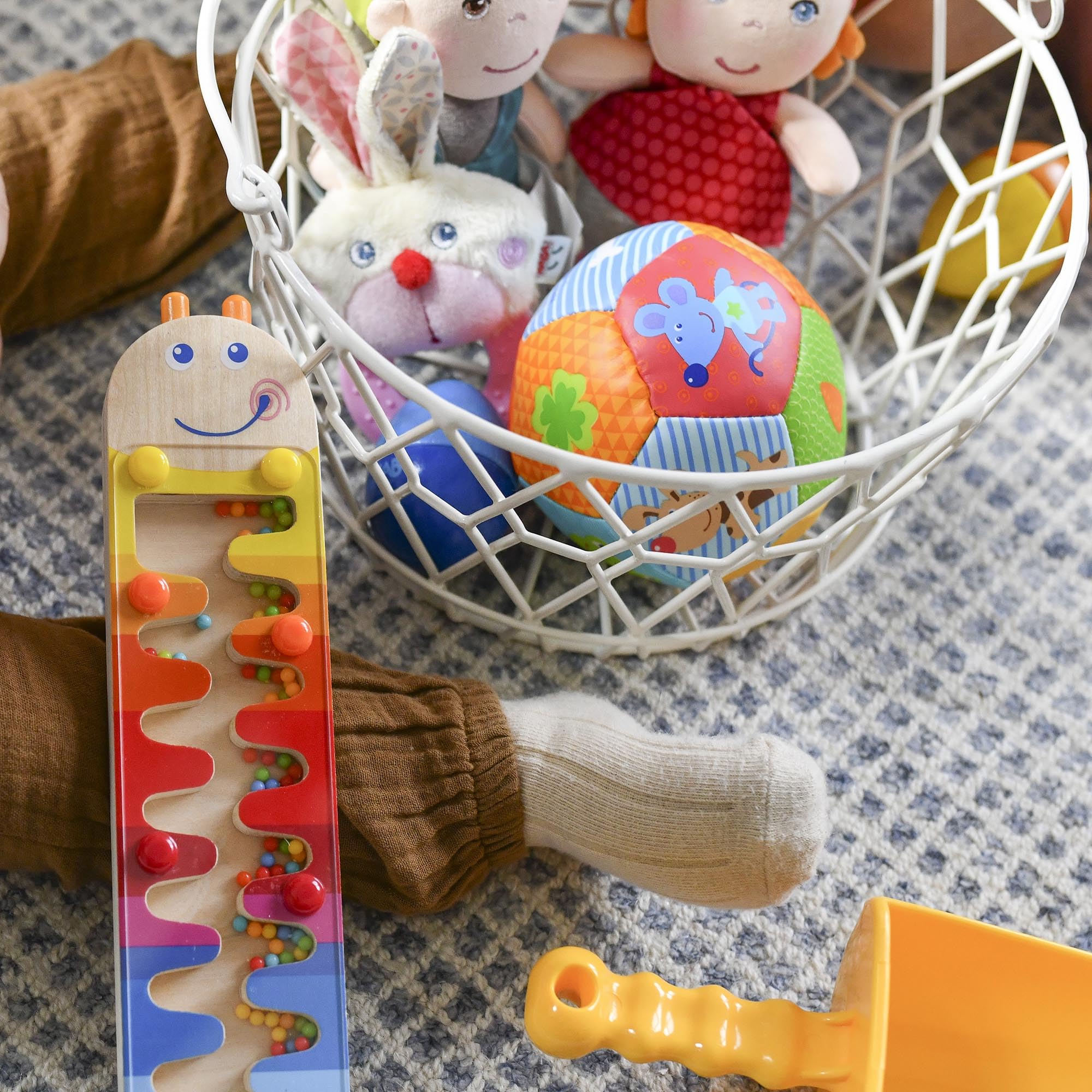 HABA Baby Balls showcase bright illustrations to spark imagination during independent play.