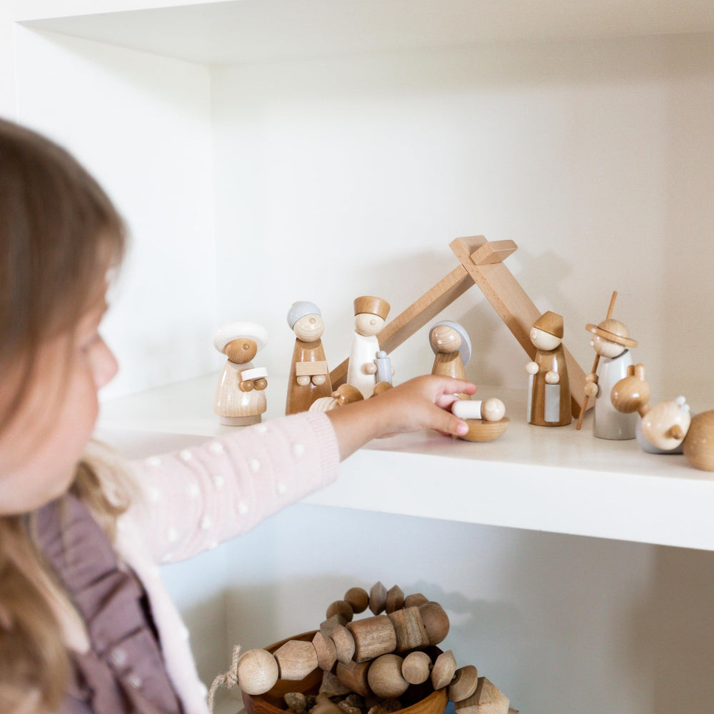 HABA beechwood stable with secure slots for display.