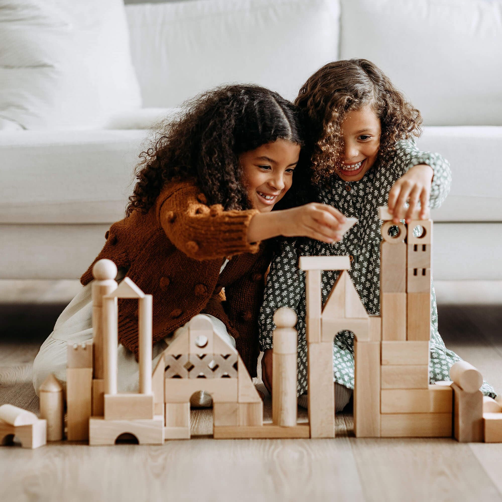 HABA blocks feature varied shapes including squares, rectangles, triangles for flexible construction.