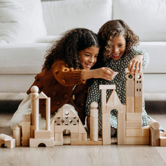 HABA blocks feature varied shapes including squares, rectangles, triangles for flexible construction.