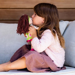 HABA Coco doll sitting upright for seated storytelling and play