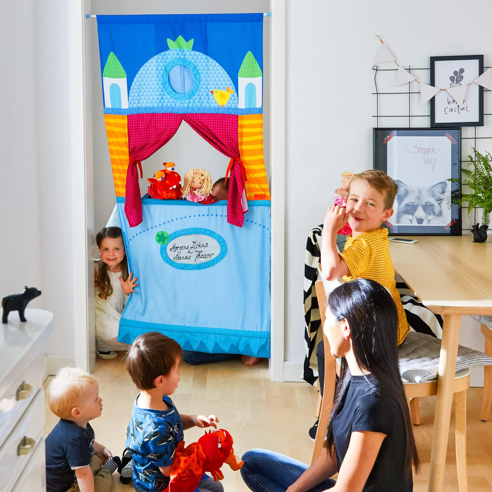 HABA Doorway Puppet Theater in action on a sturdy door frame.