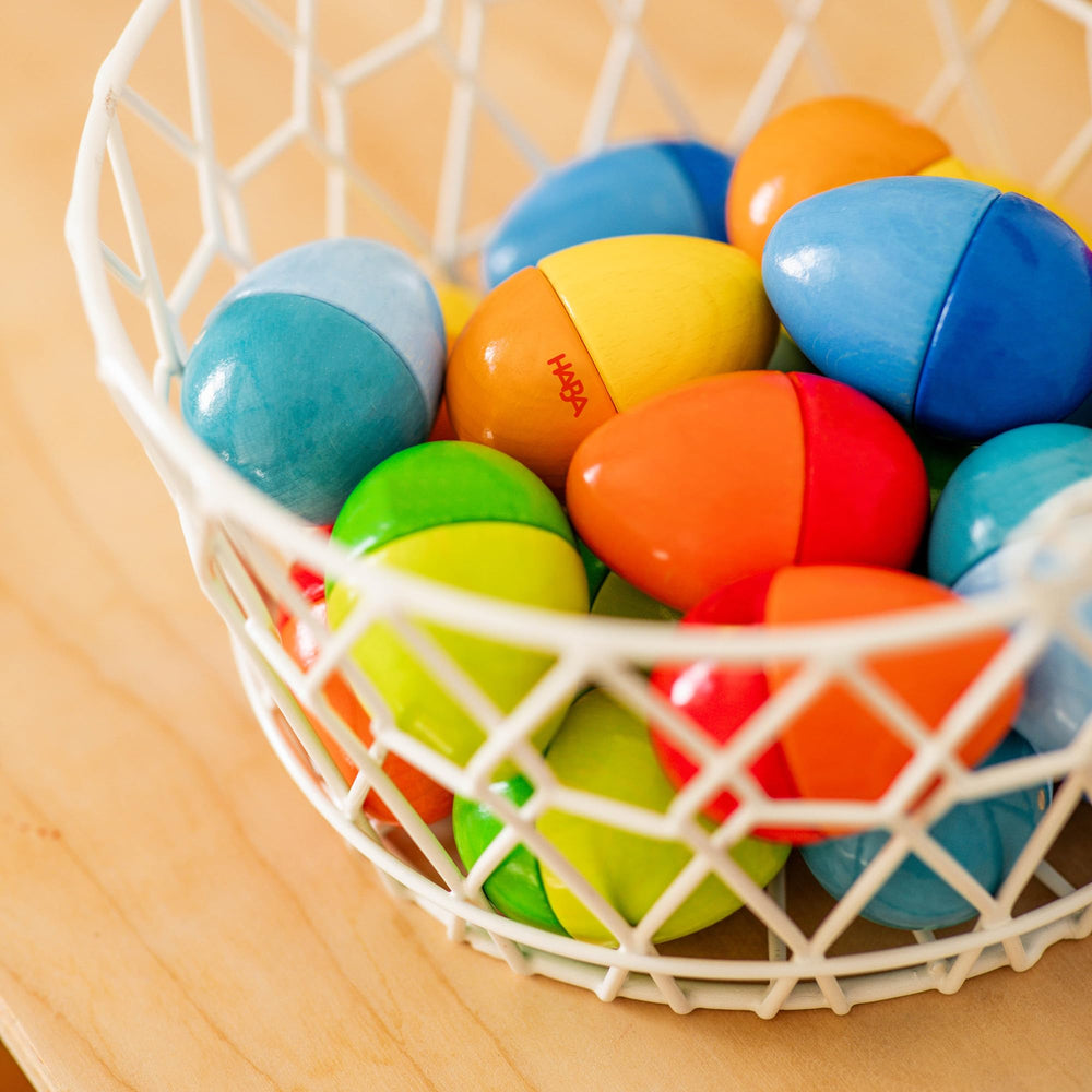 HABA Durable storage box keeps toy eggs organized after play.