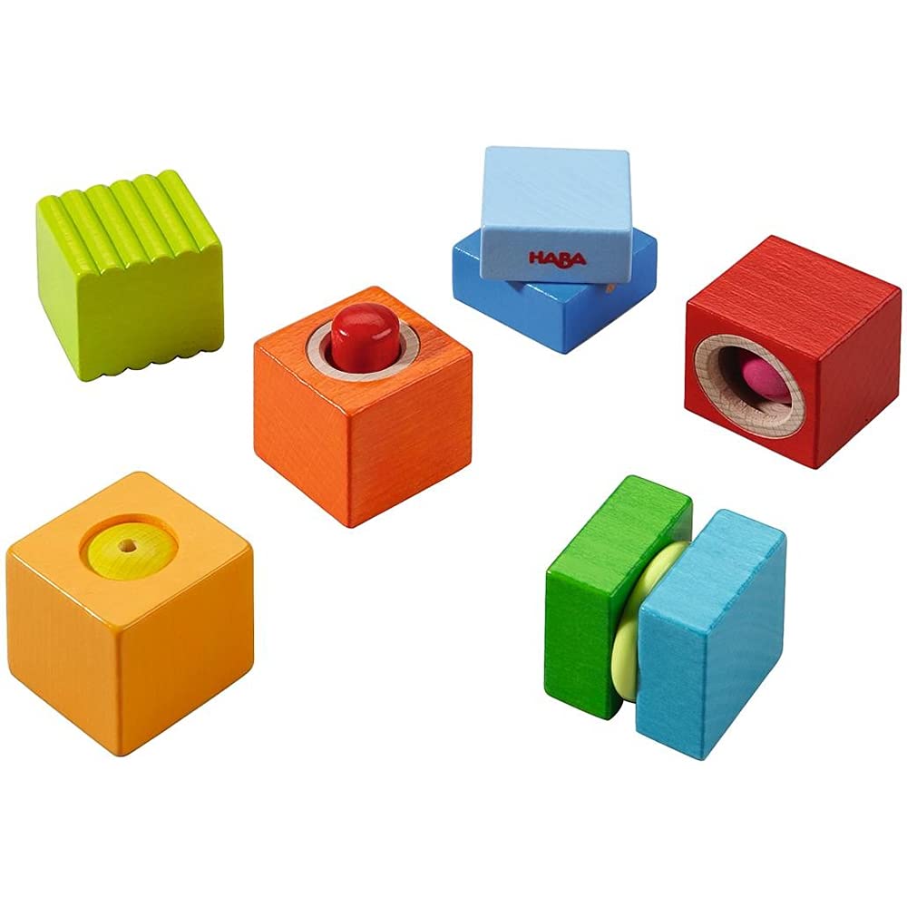 HABA Fun with Sounds wooden discovery blocks stacked for tactile learning and play.
