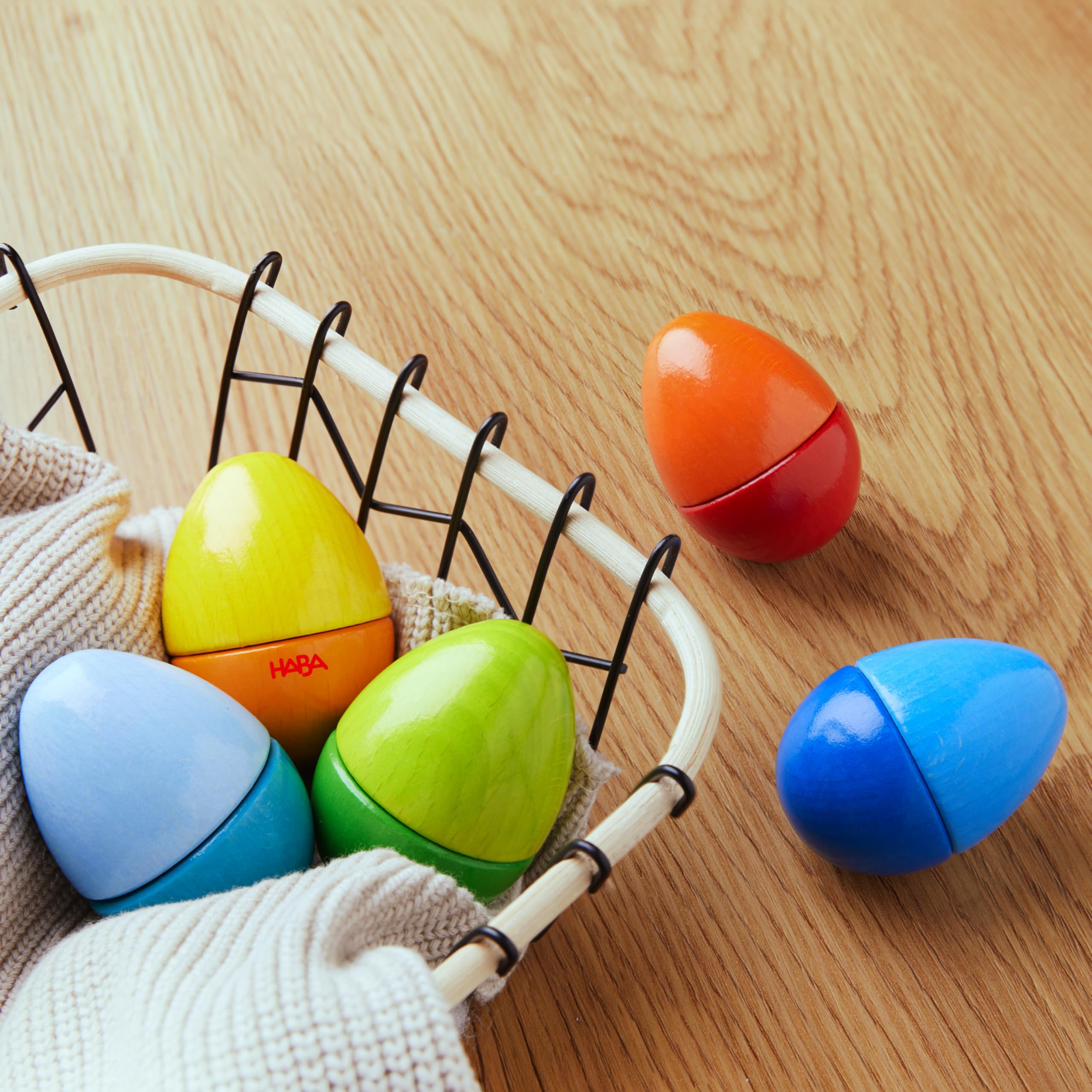 HABA Fun with Sounds wooden eggs rattling effect supports rhythm awareness during play.