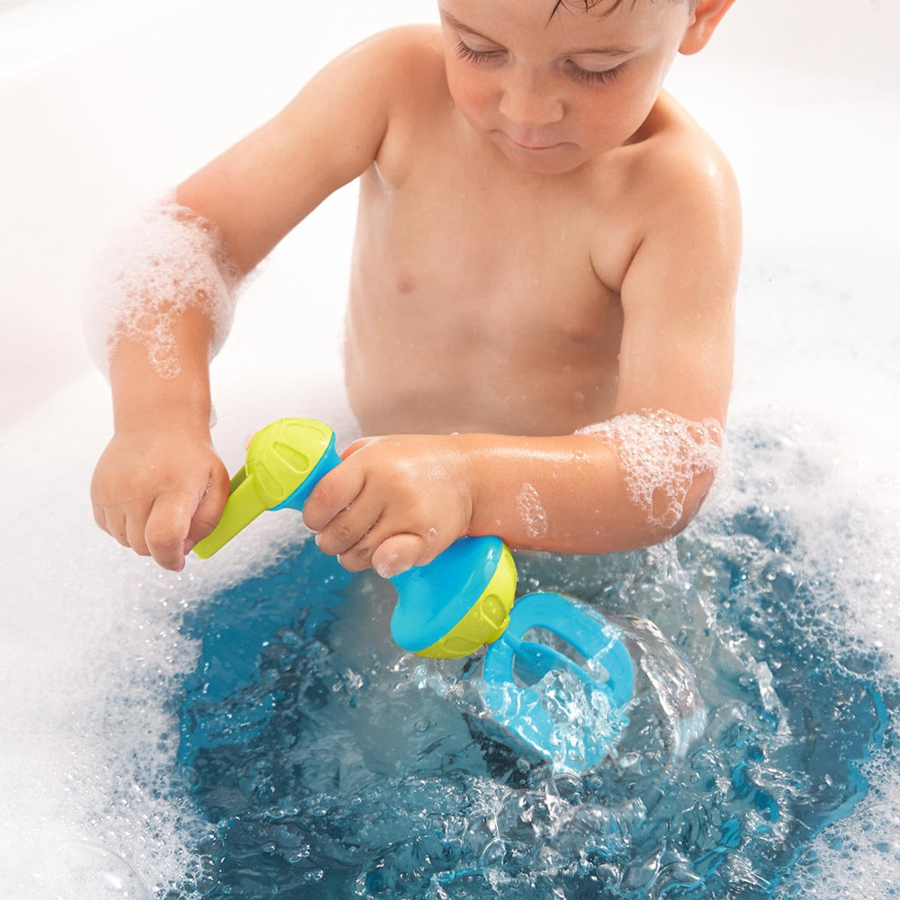 HABA ocean-blue whisk bath toy adds tactile fun to daily routines.