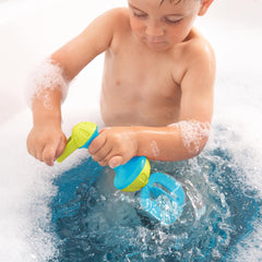 HABA ocean-blue whisk bath toy adds tactile fun to daily routines.