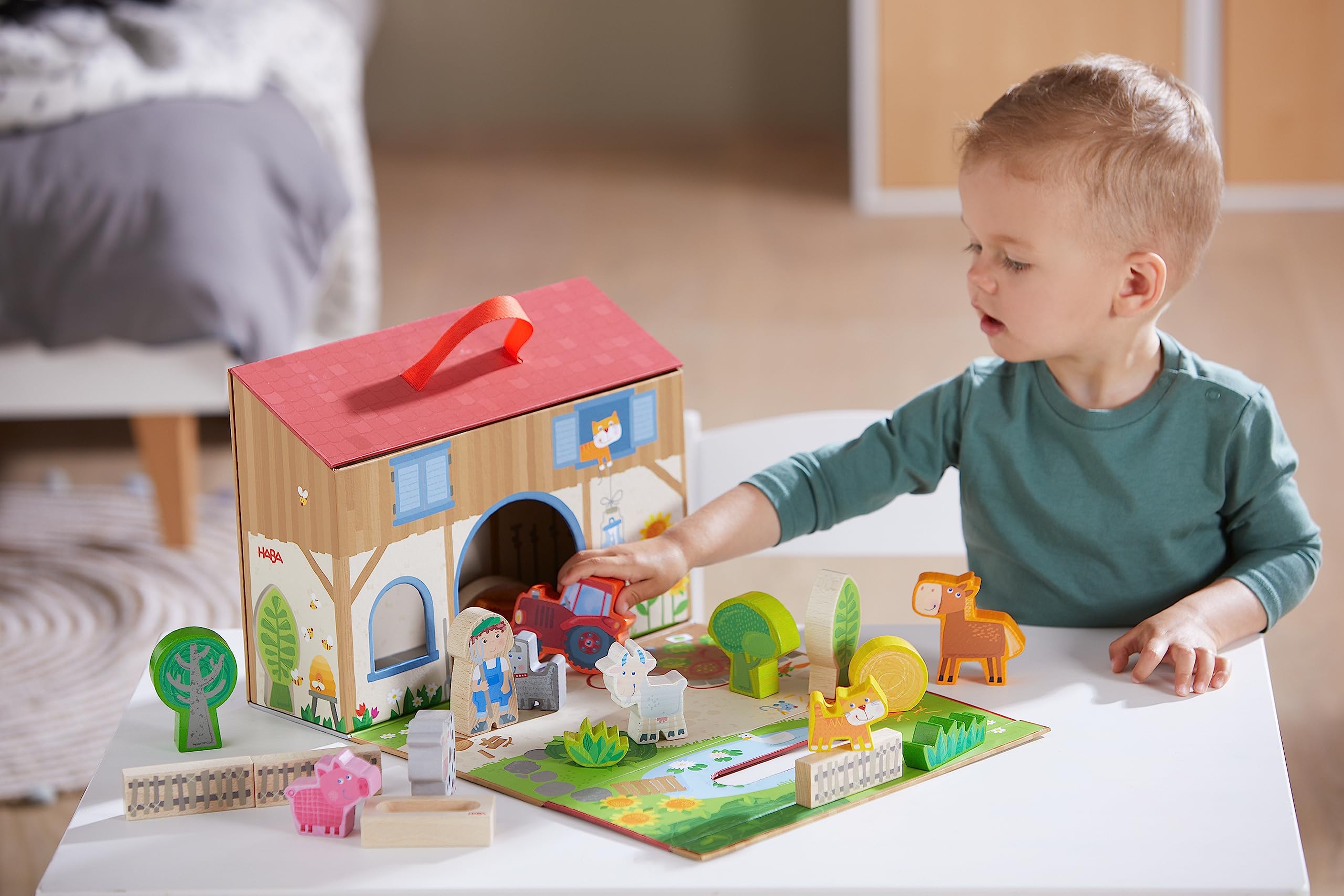 HABA Play World farmhouse packaging with handle for portable farm fun