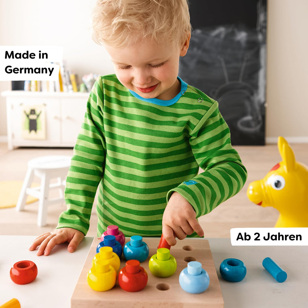 HABA Rainbow Whirls color-sort promotes color recognition and sequencing play.