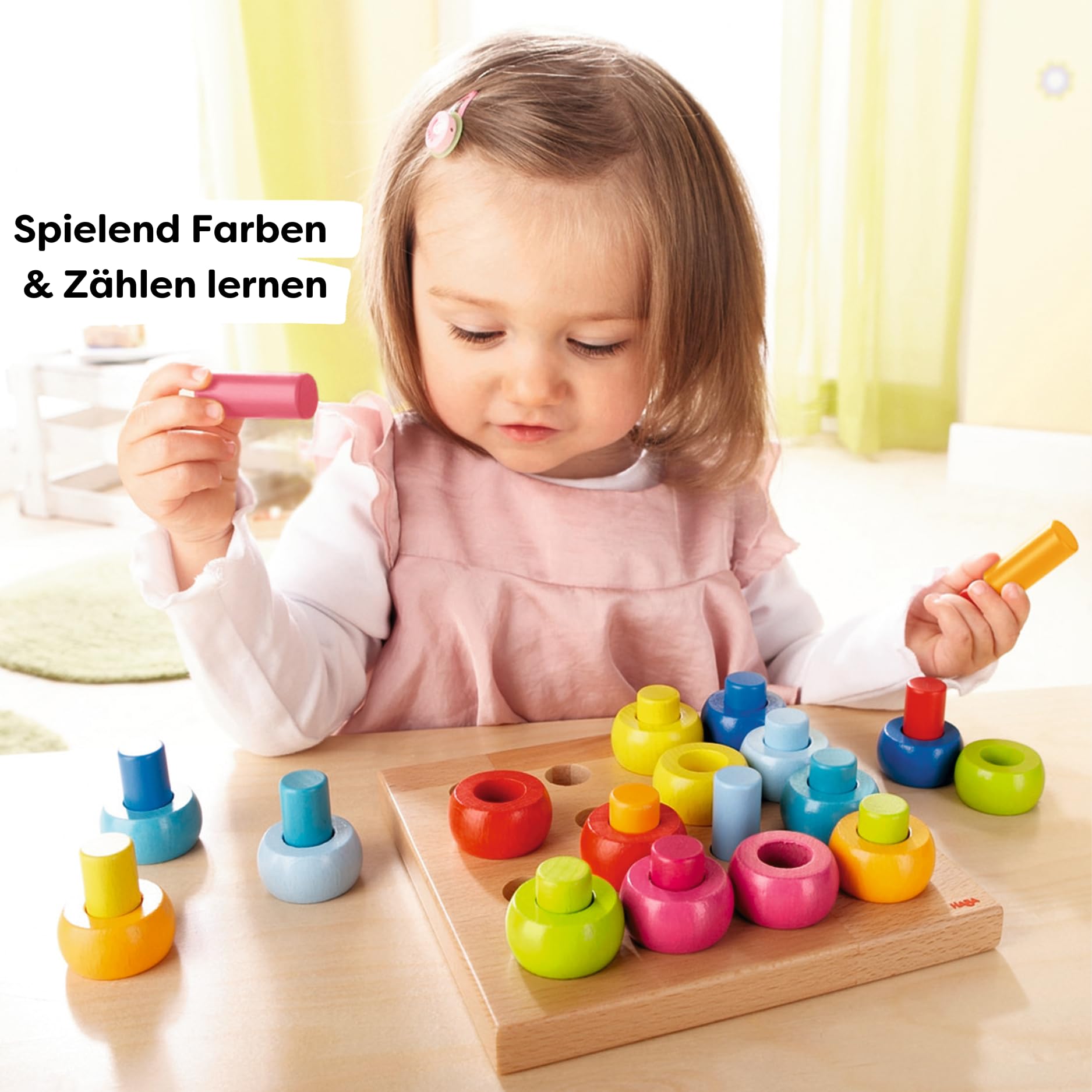 HABA Rainbow Whirls rings offer color sorting to build recognition and dexterity.