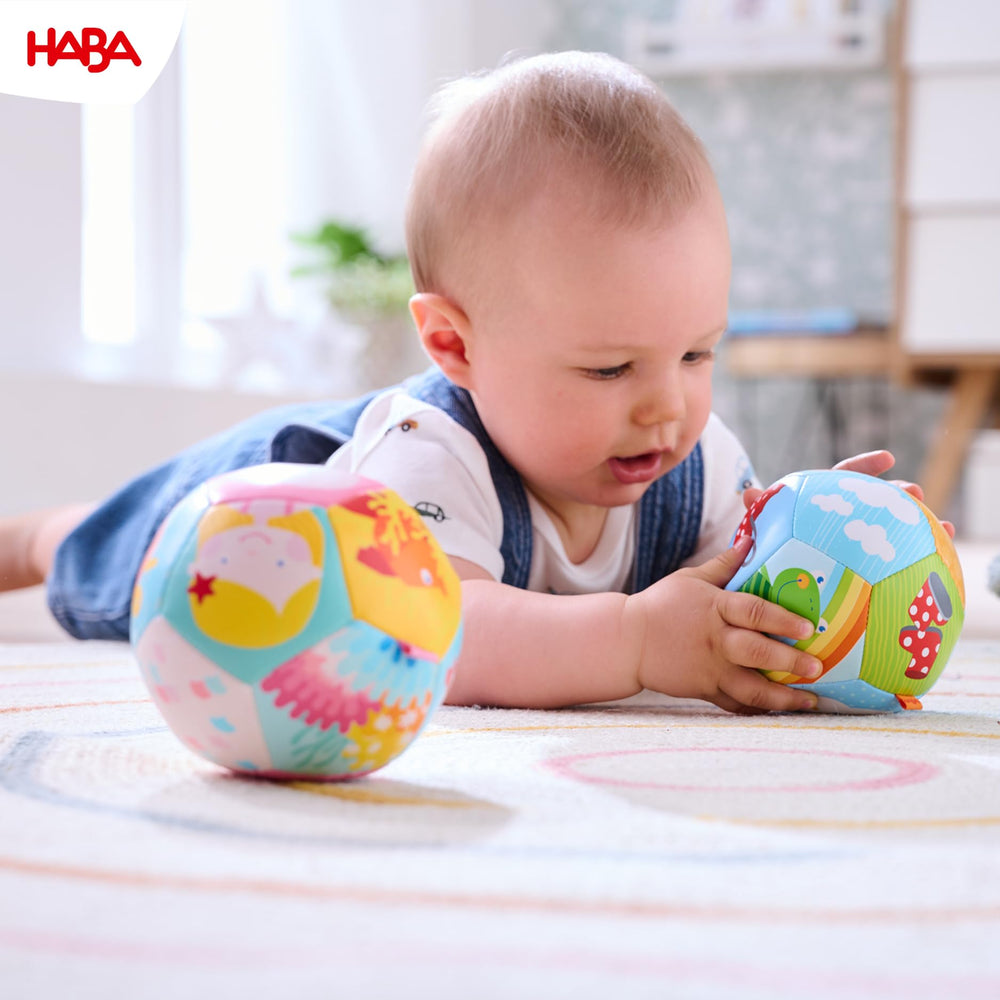 HABA colorful rainbow ball ideal for grasping and motor skill exploration.