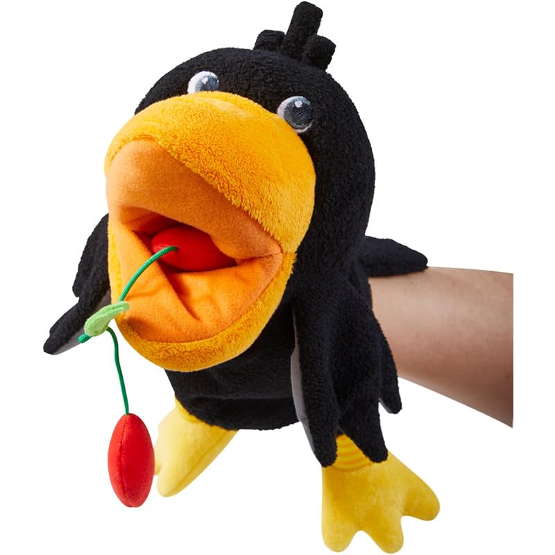 HABA Theo the Raven puppet feeding cherries sparks interactive pretend play sessions.