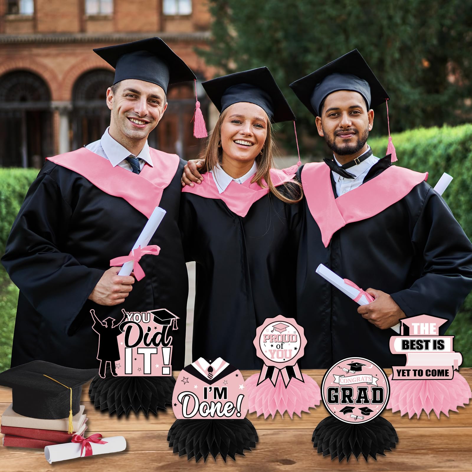 HAKOTI pink and black congrats grad table toppers decorate the party tables.