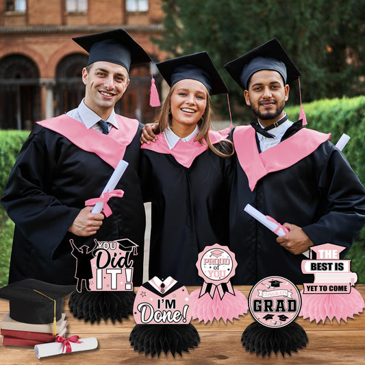 HAKOTI pink and black congrats grad table toppers decorate the party tables.