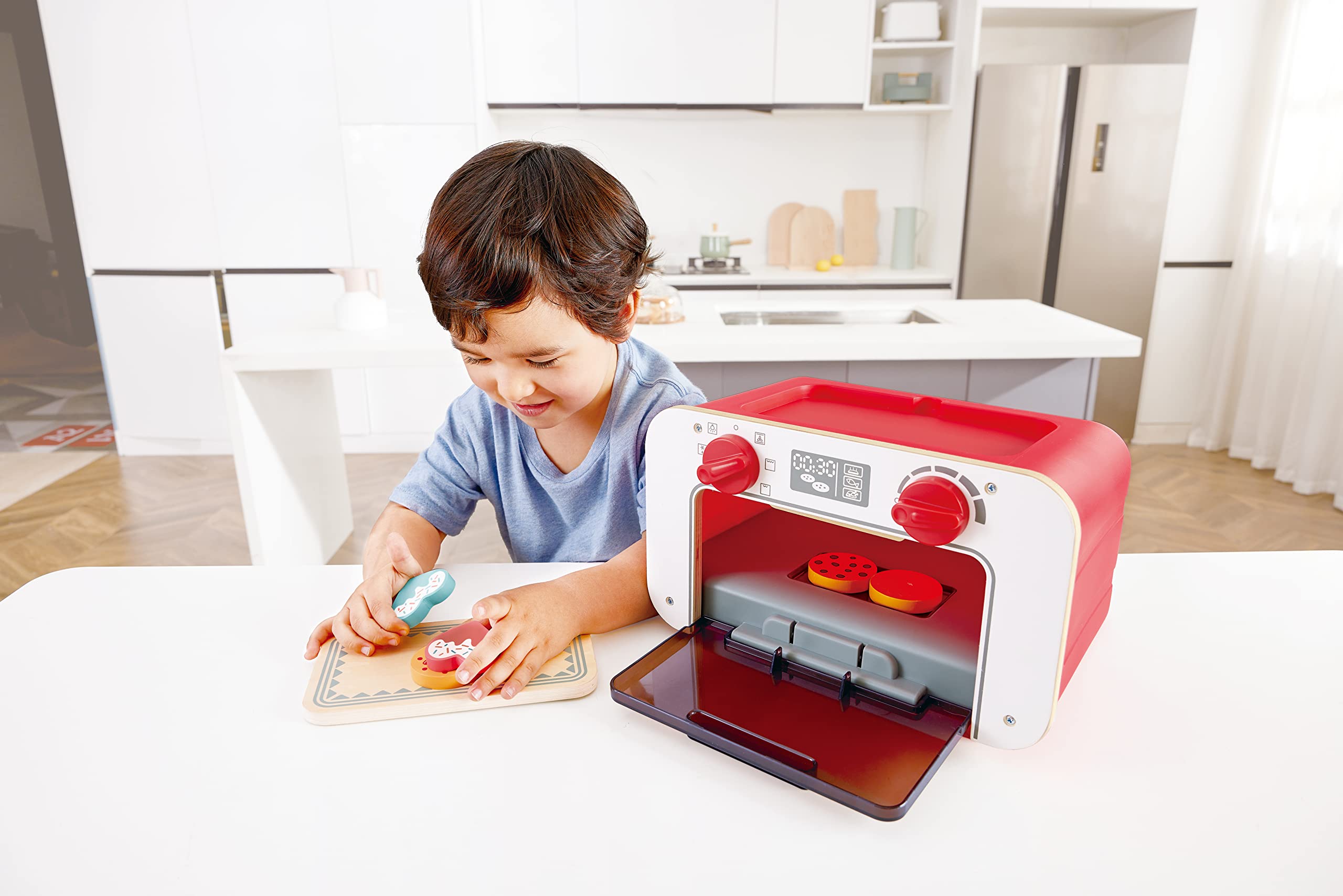 Hape baking tray with cookies ready for pretend baking.