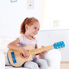 Hape blue kids guitar side view ideal for learning posture.