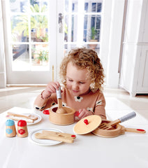 Hape Cook & Serve Set pan for hands-on kitchen play and role play.