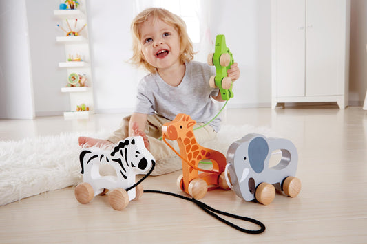 Hape elephant pull-along side view showing compact wooden design for toddlers.