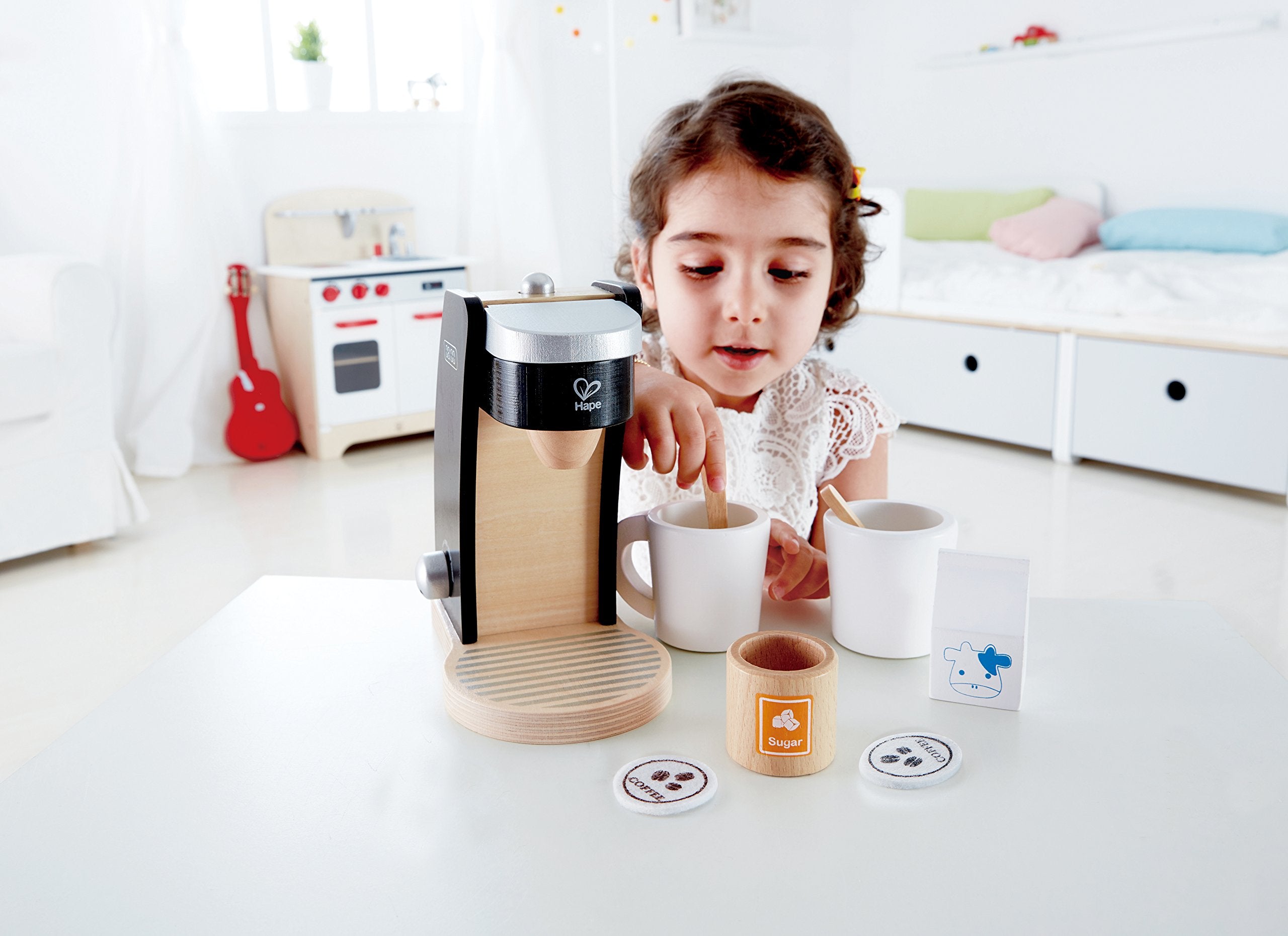 Hape felt coffee pods provide soft, safe realism for pretend coffee sessions.