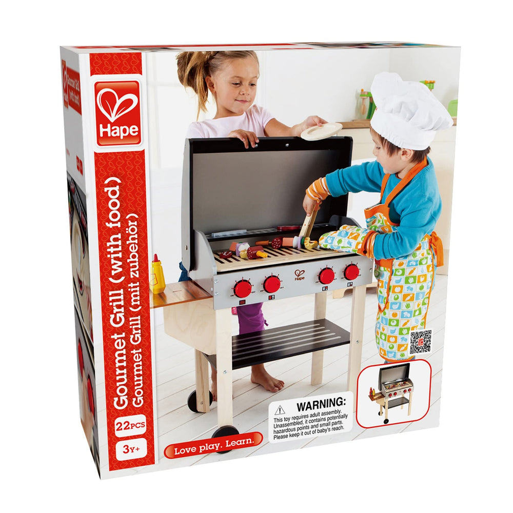 Hape Gourmet Grill with double-sided grates slide out to reveal pretend coals.