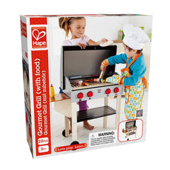 Hape Gourmet Grill with double-sided grates slide out to reveal pretend coals.