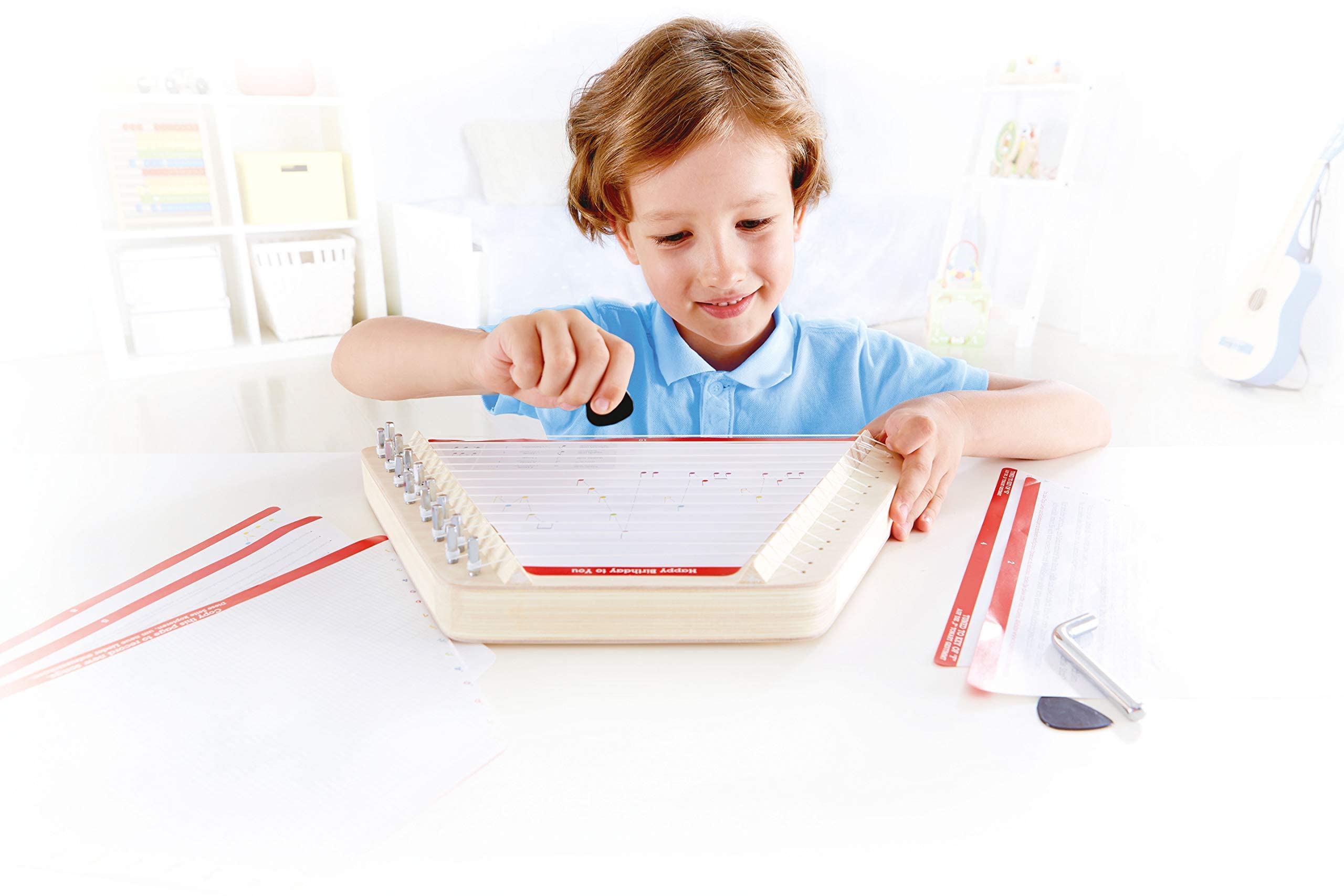 Hape Happy Harp close-up shows wooden craftsmanship and safe, tunable nylon strings.