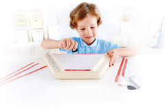 Hape Happy Harp close-up shows wooden craftsmanship and safe, tunable nylon strings.