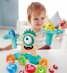 Hape Math Monster Scale shows balancing actions that spark logical thinking.