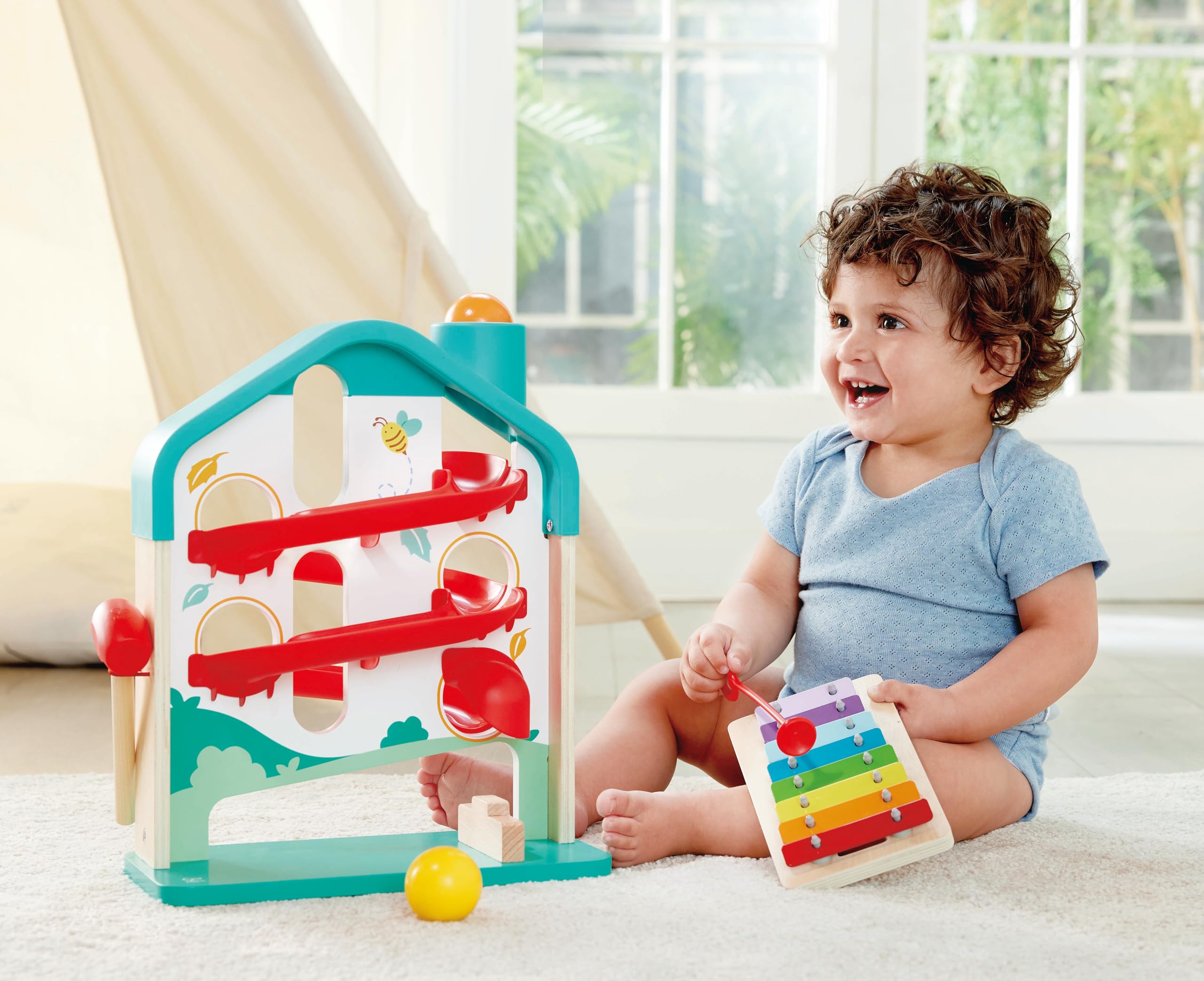 Hape Melody Mansion colorful balls promote color recognition and fine motor exploration