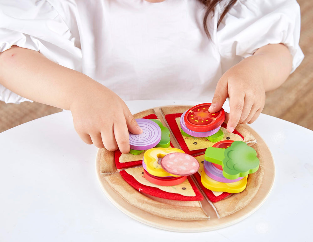 Hape Perfect Pizza Base with sliceable core for customizable pretend pizzas.