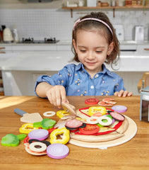 Hape Pizza Cutter ensures safe, smooth slicing during playtime.