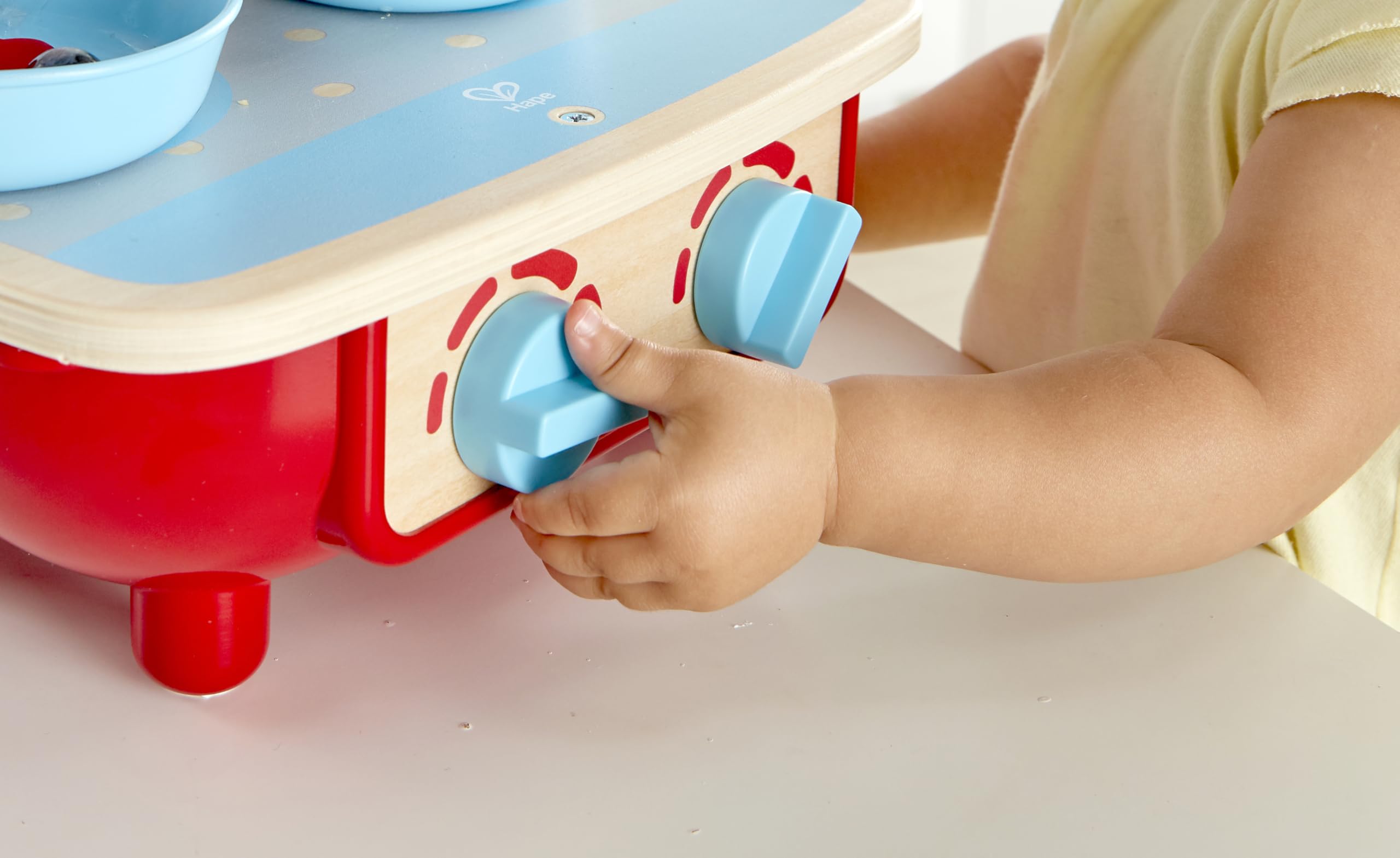 Hape Toddler Kitchen Set pot-lid image includes authentic cooking pot for pretend meals