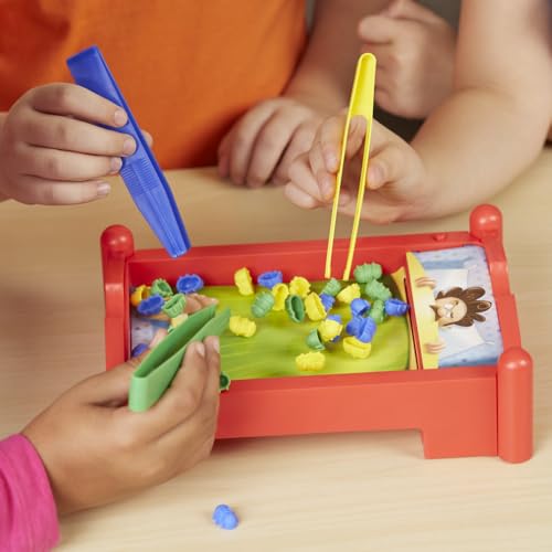 Hasbro Bed Bugs blue yellow green tongs help kids grab colors.
