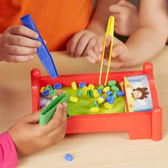 Hasbro Bed Bugs blue yellow green tongs help kids grab colors.