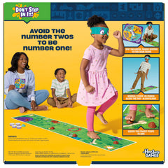 Hasbro Gaming Don't Step in It! Blindfolded player crossing the mat during play