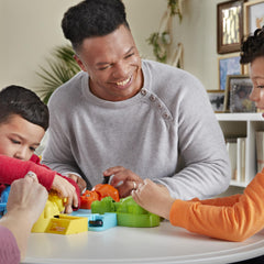 Hasbro Gaming Hungry Hungry Hippos kids playing depicts family fun and friendly competition.