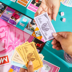 Hasbro Gaming Monopoly Barbie Fun board game rent and money tracking adds strategy.